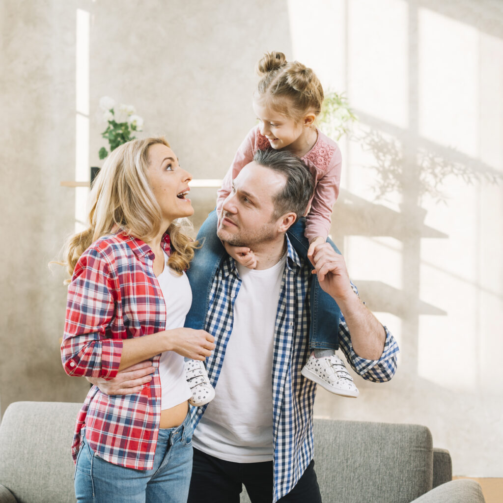 cute-family-smiling-home