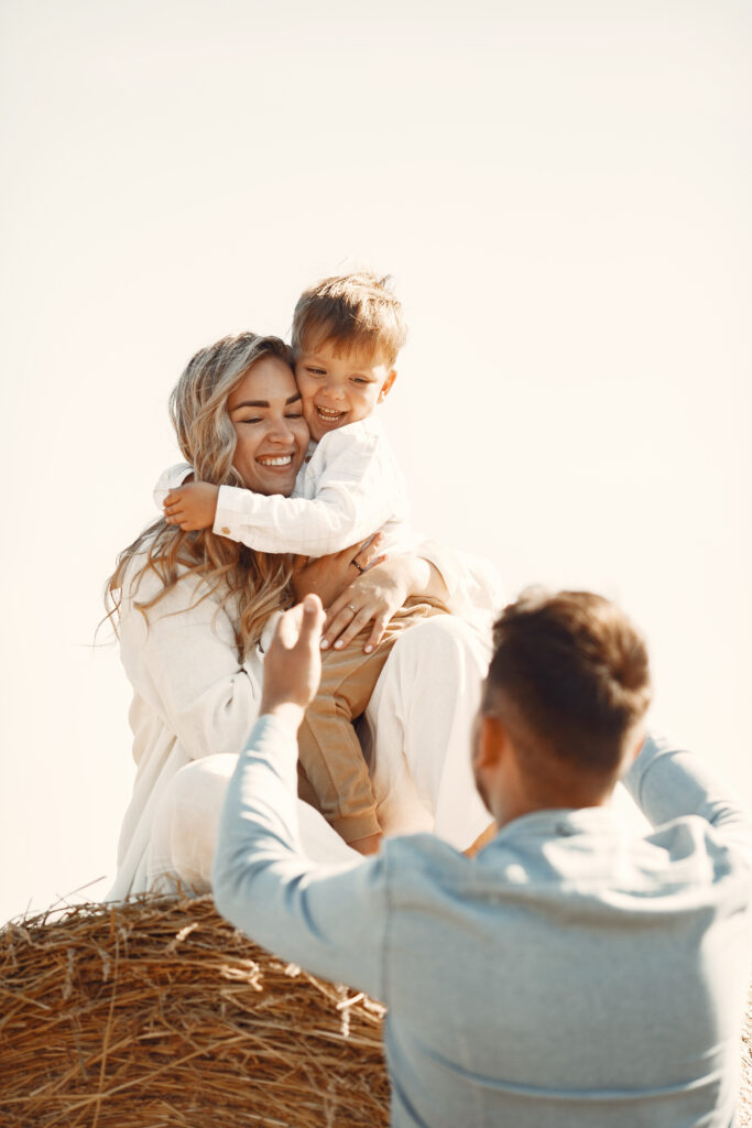 family-playing-with-baby-son-wheat-field-sunset-concept-summer-holiday-family-spending-time-together-nature