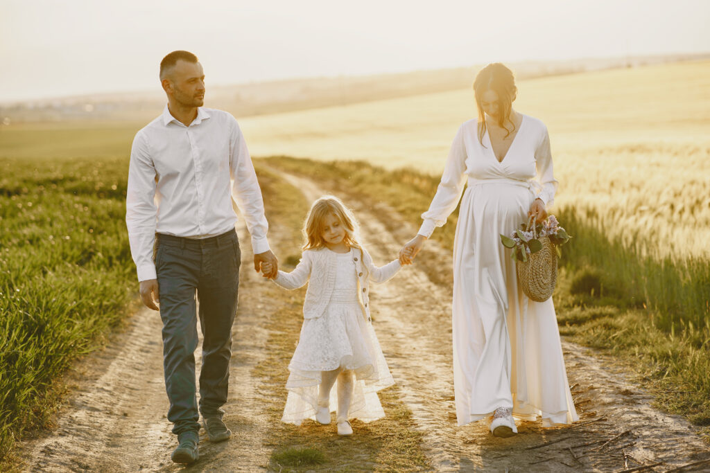 family-with-little-daughter-spending-time-together-sunny-field