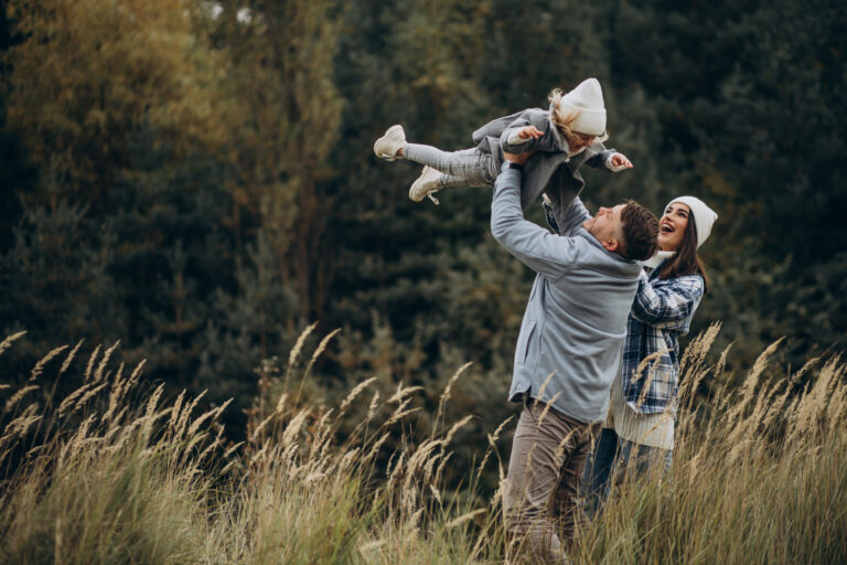 family-with-little-daughter-together-autumnal-weather-having-fun